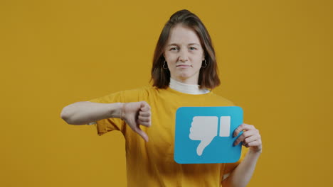 woman holding a thumbs down sign