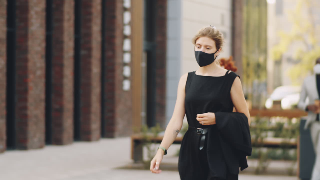Business People in Protective Masks Walking on Street