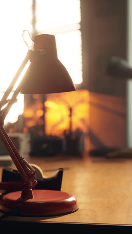 red desk lamp in office setting