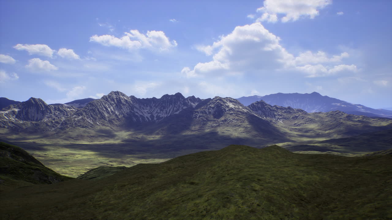Majestic mountain range and valleys under a sunny sky in daytime