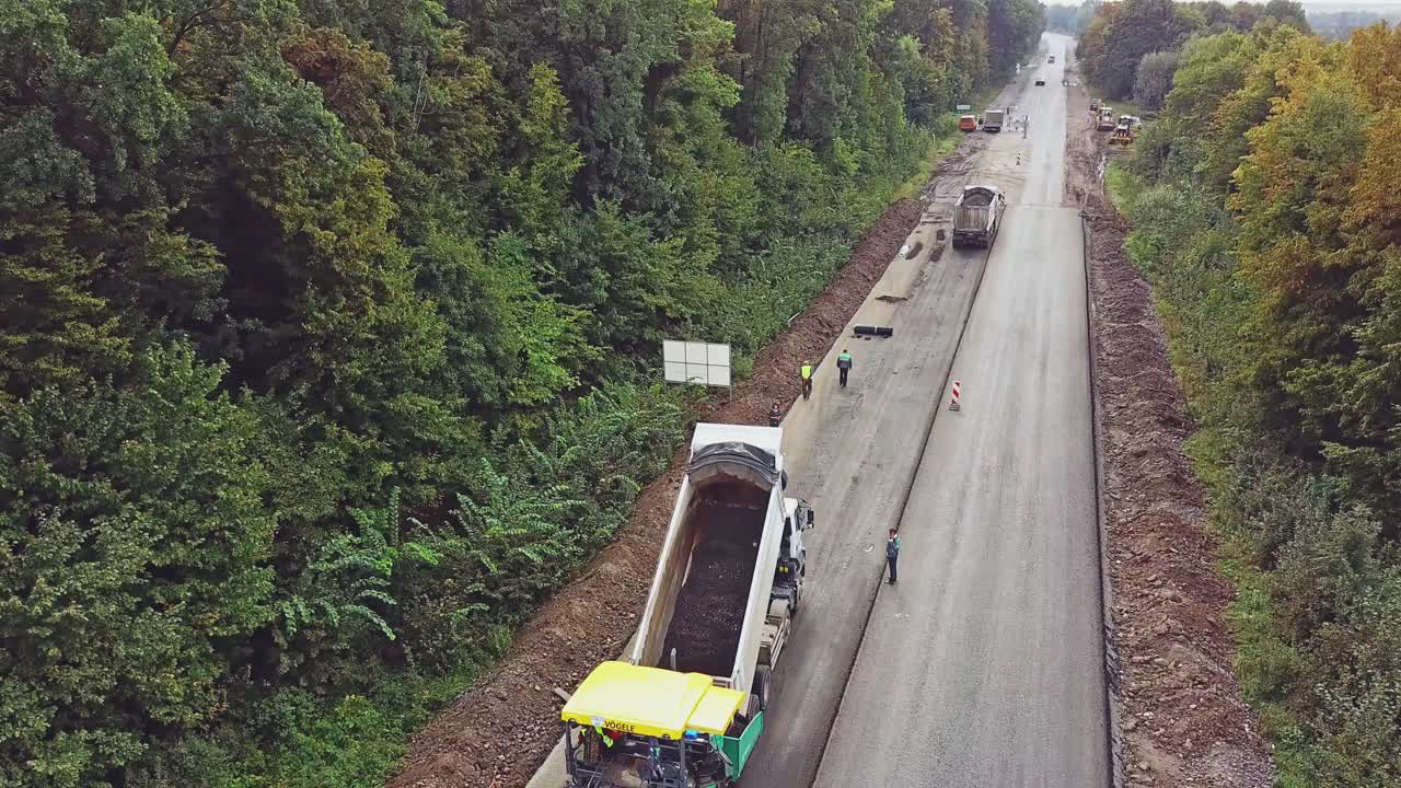 Aerial view. Laying a new asphalt on the road. Construction of the road