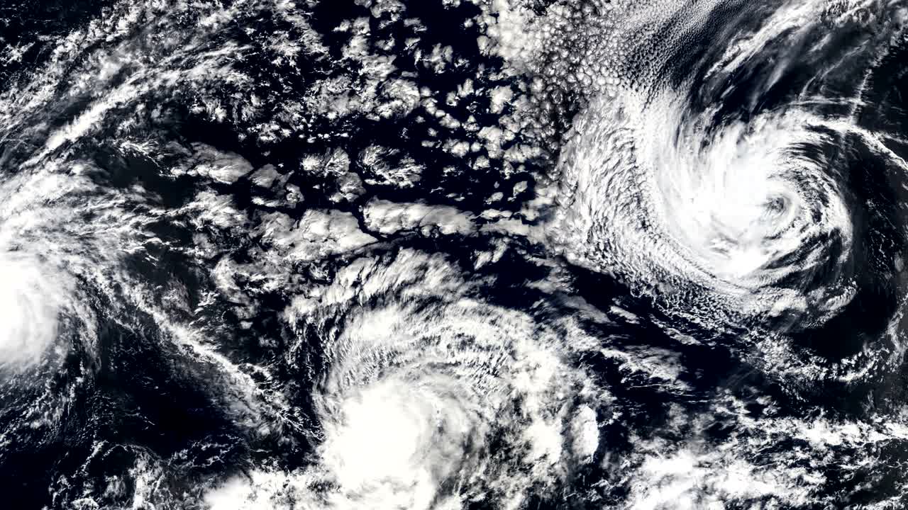 Three Hurricanes, Storms tornado, satellite view. Some elements of this video furnished by NASA.