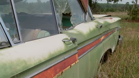 an old ford edsel sits in a field 6