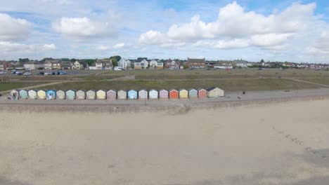 Aerial-Drone-Footage-of-the-Beautiful-Beach-Huts-on-the-coast-of-Gorleston-On-Sea,-Norfolk