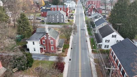 Aerial-above-road-in-small-town-in-USA