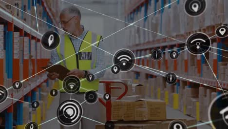 Network-of-digital-icons-over-caucasian-male-supervisor-with-clipboard-checking-stock-at-warehouse