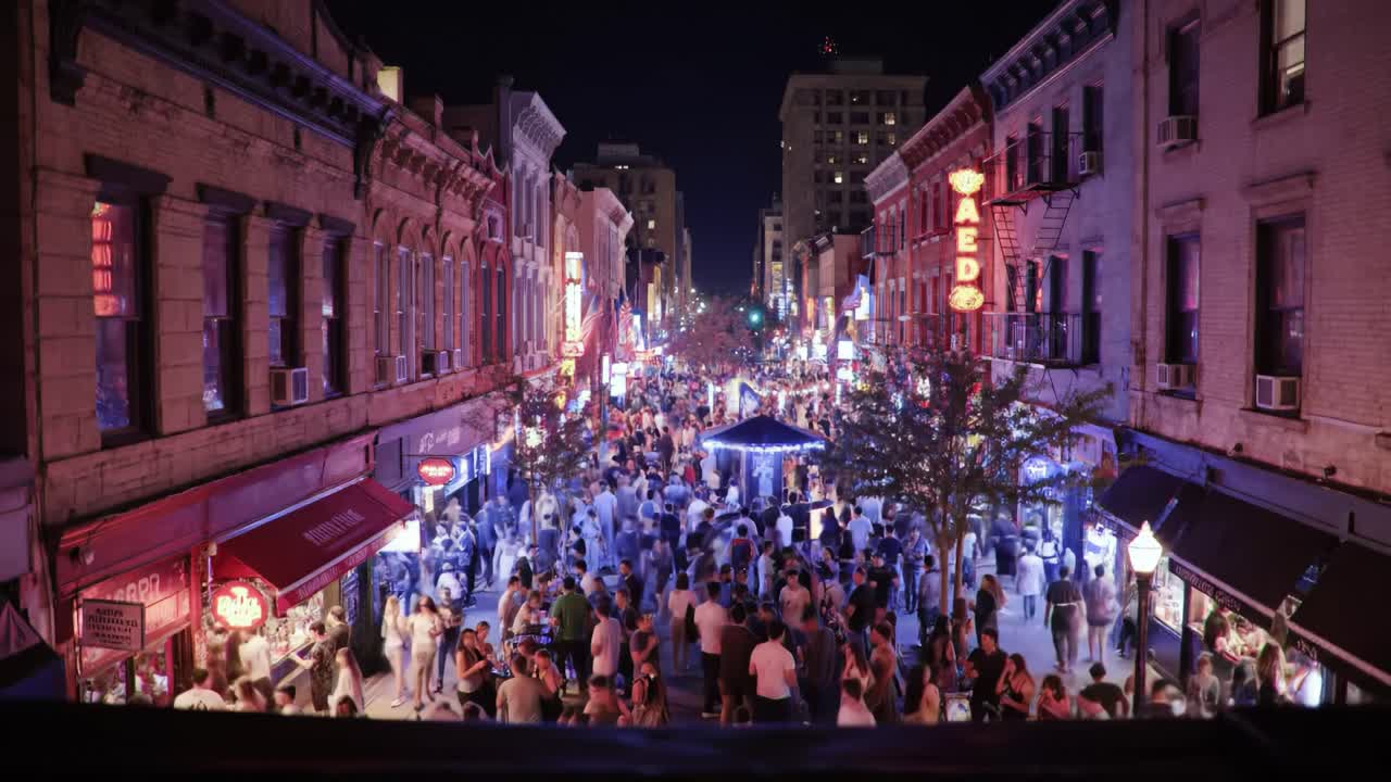 Nighttime City Street with Crowds
