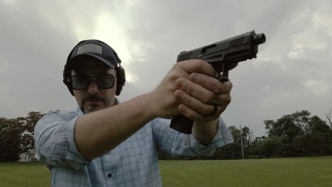 wide angle shot of man firing pistol