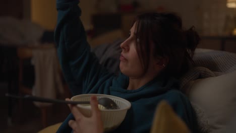 woman eating soup at home