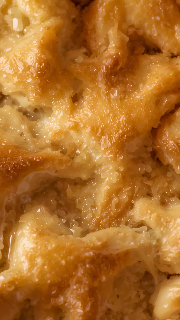 Vertical video: Starting pan, camera scanning glazed pastry on counter, highlighting glaze texture