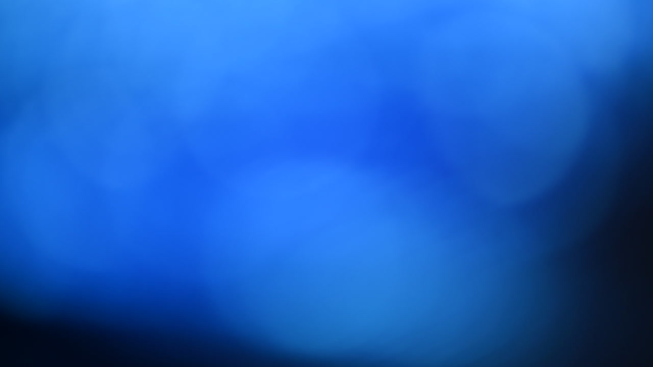 Abstract blue bokeh background with soft circular lights