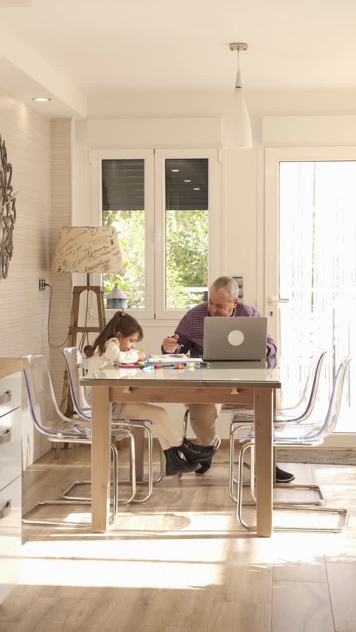 Grandparent woking next to a girl at home