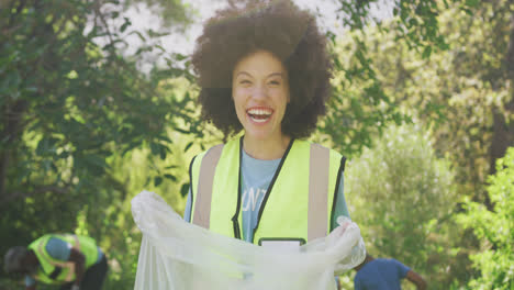 happy family cleaning a garden together