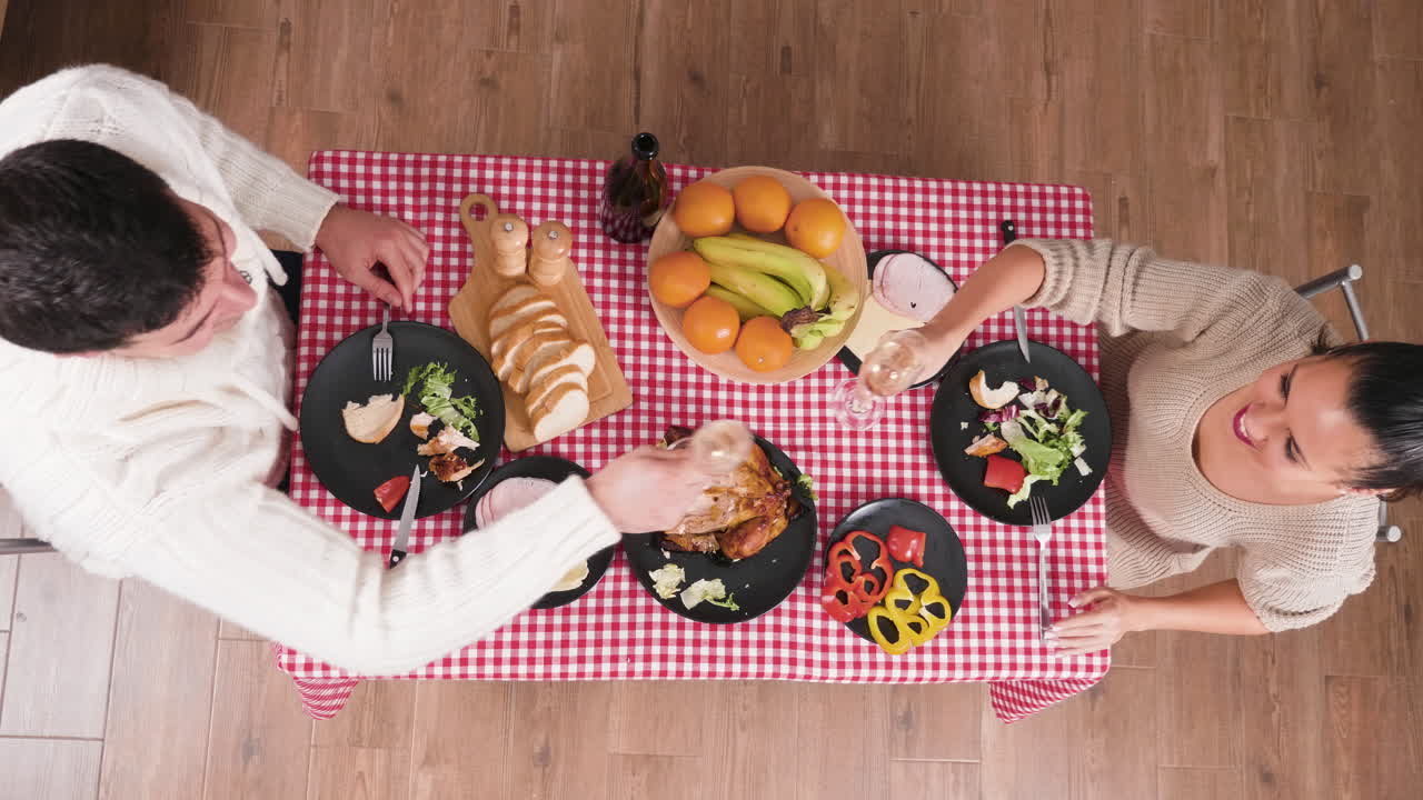 Overhead Shot of People Eating Meal Together at Table
