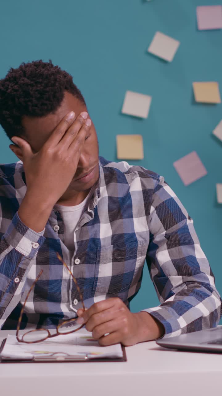 Tired and Frustrated Businessman at Desk