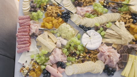 immaculately prepared and ind inviting platter of fruit, chocolate, cheese and dips