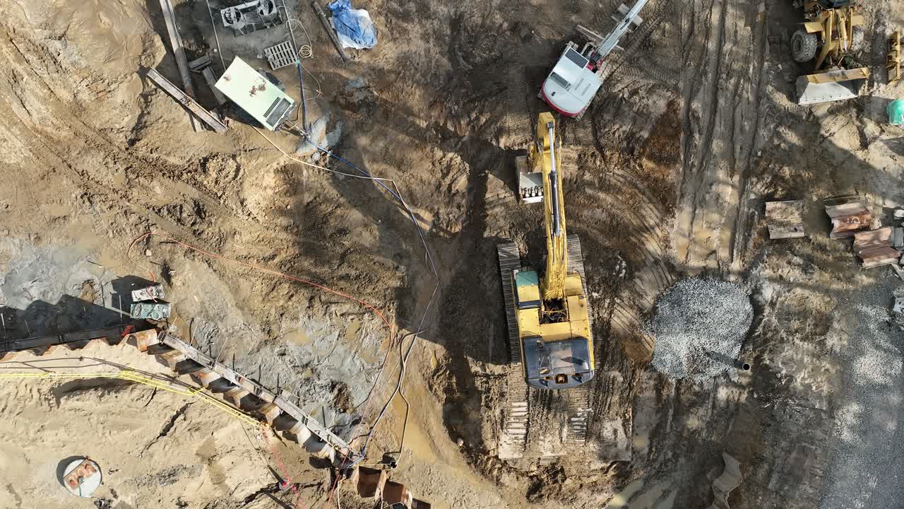 Aerial View of Construction Site with Excavator