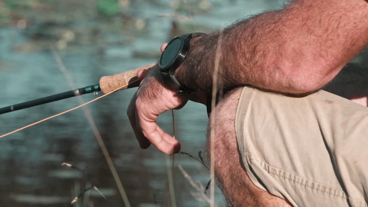 Fisherman relaxing by the river