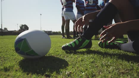 young adult female rugby player on a rugby pitch