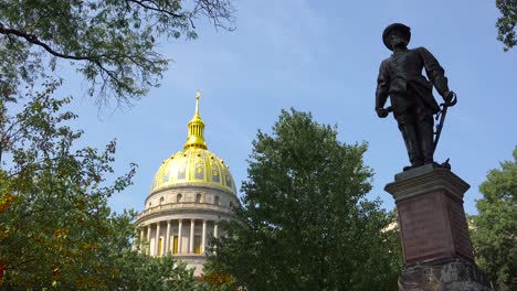 a confederate statue stands in front of the capital building in charleston west virginia 1