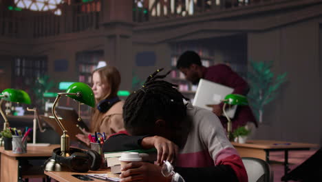 vertical video african american student falling asleep on books pile in the campus library
