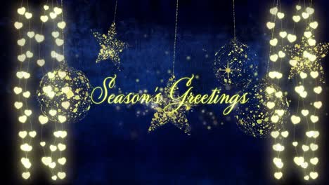 animation of seasons greetings over golden baubles and light chains