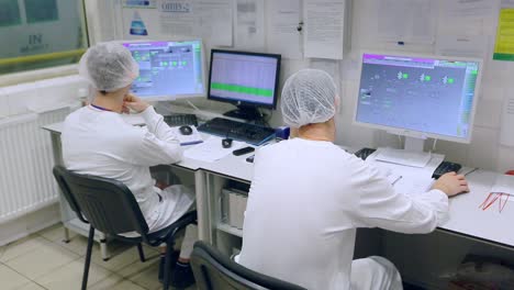 factory control room. industrial workers in control room. plant control room