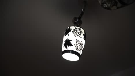 close up shot of a hanging lamp with floral pattern