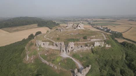 aerial view of historical castle ruins on serene landscape