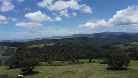 cinematic aerial drone footage of the kenya rift valley showcasing dramatic skylines, rolling hills, deep valleys, and lush forests with a cool blue hue. a breathtaking african landscape