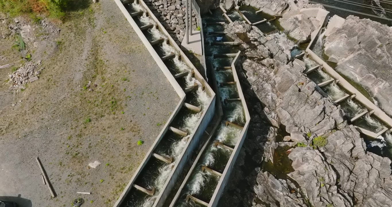 Aerial view of fish farm channels at Rykene Norway in slow motion showing bird s eye view