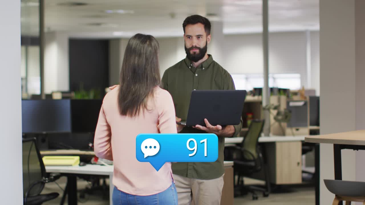 Man holding laptop woman gesturing, office chat alert causing badge rising near them tracking chats