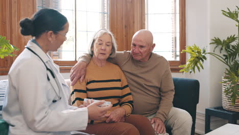 senior couple, doctor and medication in pills