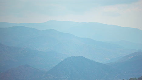 Cloudy-sky-Timelapse-with-layers-of-hills-landscape-on-a-rainy-day-with-fog-at-Mount-Olympus