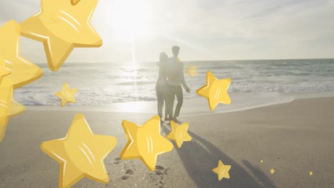 animación de estrellas sobre pareja biracial en la playa.