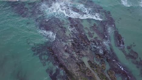 top down view of flying over shallow waters