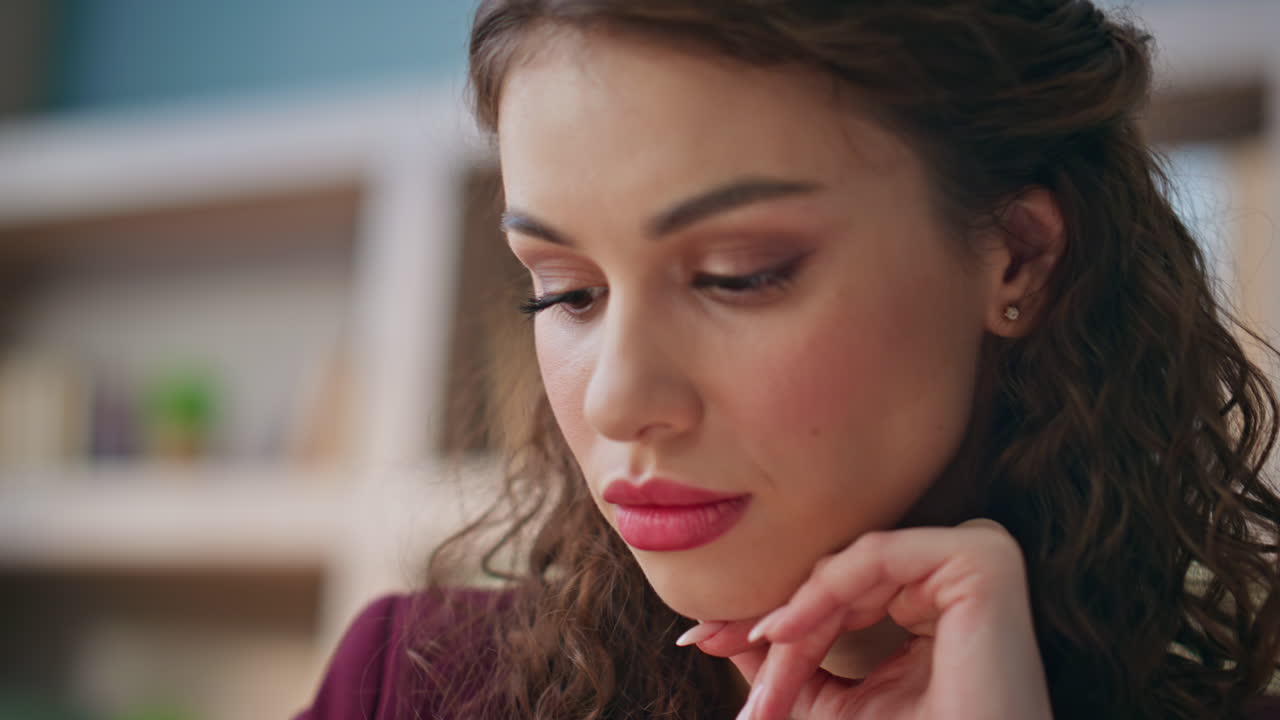 Closeup thoughtful businesswoman face look camera in office. Pensive woman work