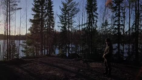 Landowner-admire-overlooking-and-inspecting-his-ranch-land-property-at-sunset,-rustic-scenery,-smooth-Aerial-drone-shot