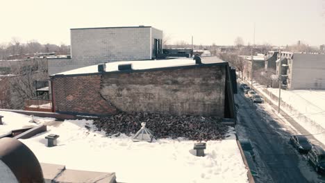 broken, fallen brick wall on roof