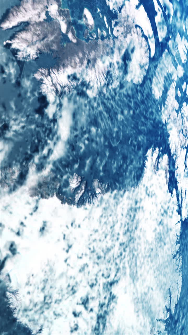 Orbiting view of Greenland from space with atmospheric glow on horizon. Vertical video 9:16 format. Ideal for social media content focused on climate change, global warming