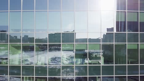 modern building facade with city reflection in winter