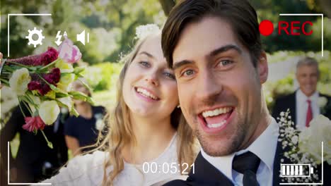 animation of digital camera interface over caucasian married couple smiling to camera