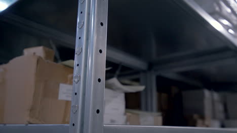 warehouse storage shelves with cardboard boxes