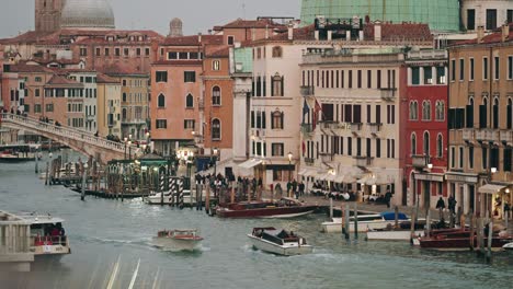 taxi boats passing through the grand canal in venice