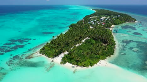 paradise tropical island in the middle of indian ocean surrounded by beautiful turquoise lagoon with abstract patterns of coral reef and white sand