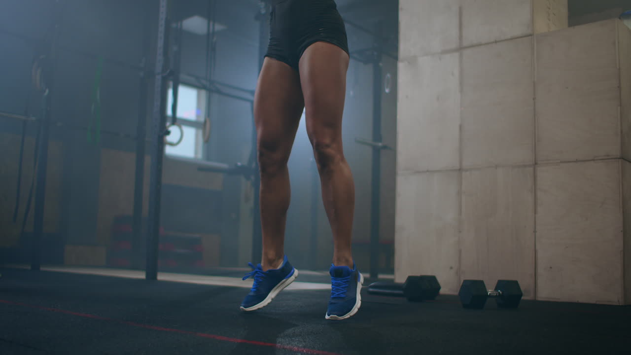 close up slow motion Athletic Woman Wipes Sweat from Her Forehead with a Hand. She's Tired after Intensive Fitness Exercise.