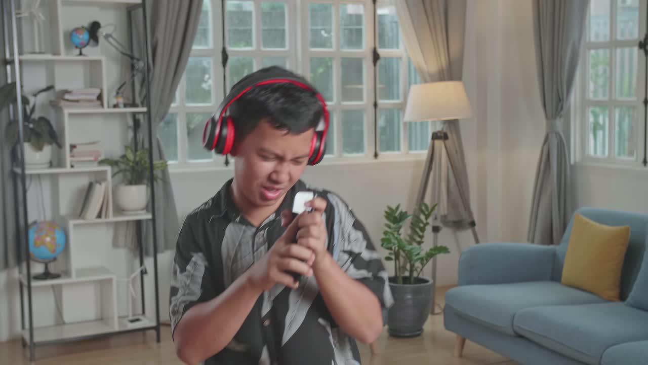 Cheerful Young Boy Listen Music With Headphones, Sing Song In Mobile Phone At Home