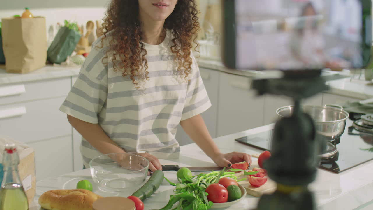 Female Food Blogger Filming Vlog in Kitchen with Smartphone