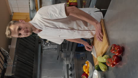 portrait of smiling chef in restaurant kitchen