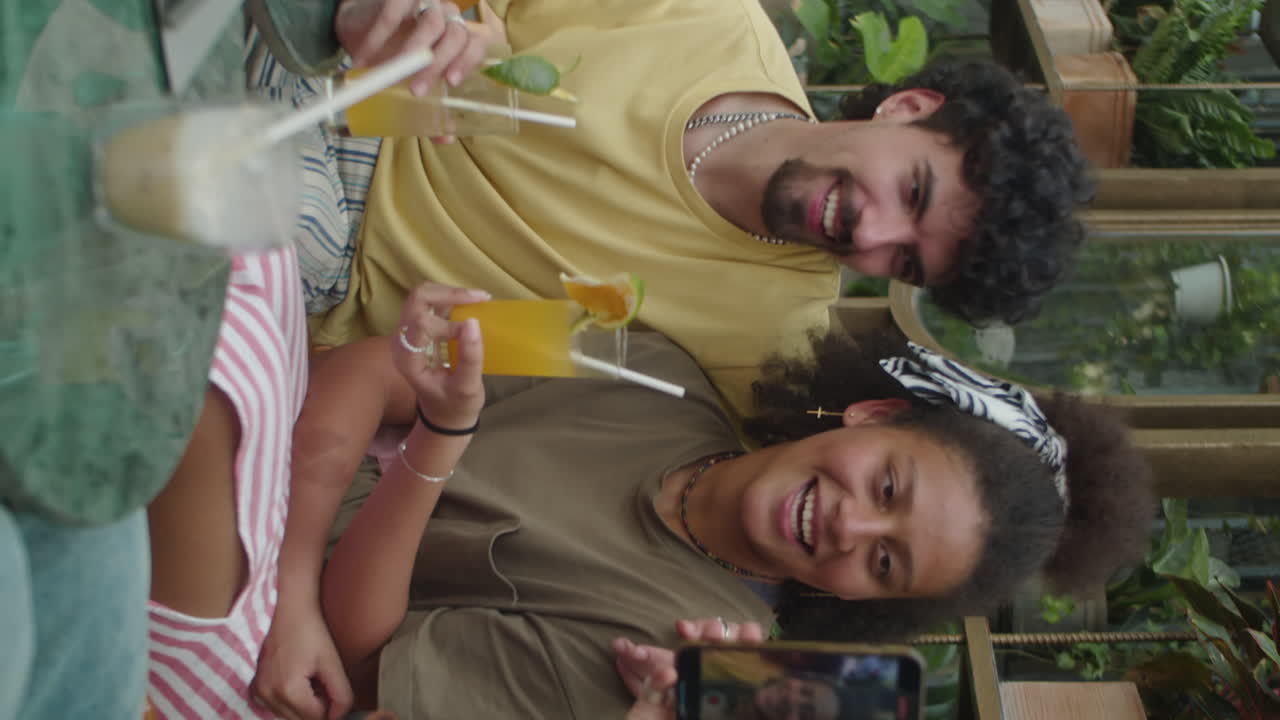 Young Couple Posing for Photos in Outdoor Cafe